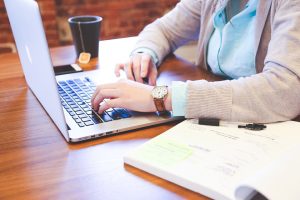 person working on a laptop at a desk