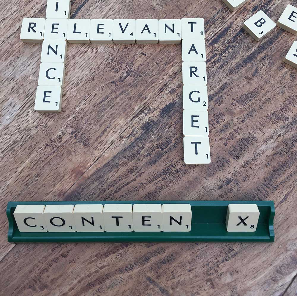 Scrabble tiles spelling out "relevent,content"