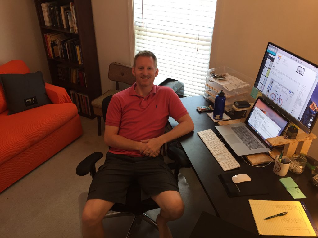 Luke at his home office desk.