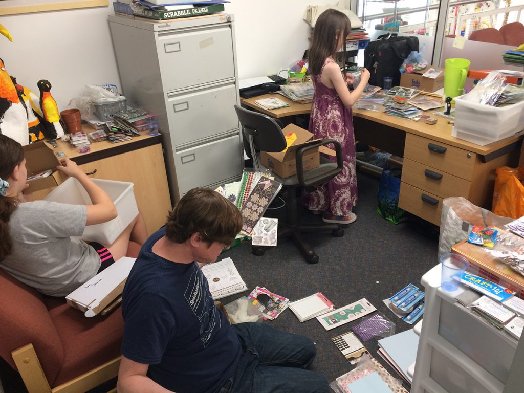 All hands on deck to sort through donations.