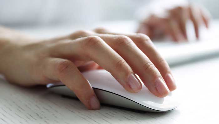 Woman clicking her mouse