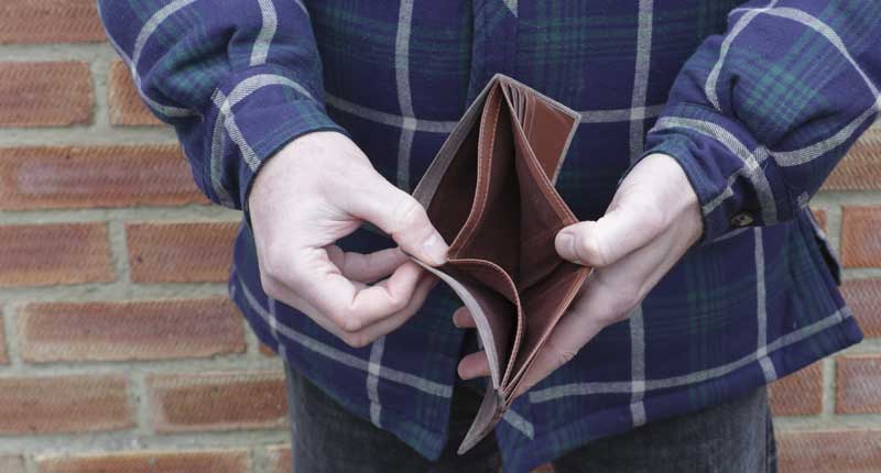 Man showing his empty wallet