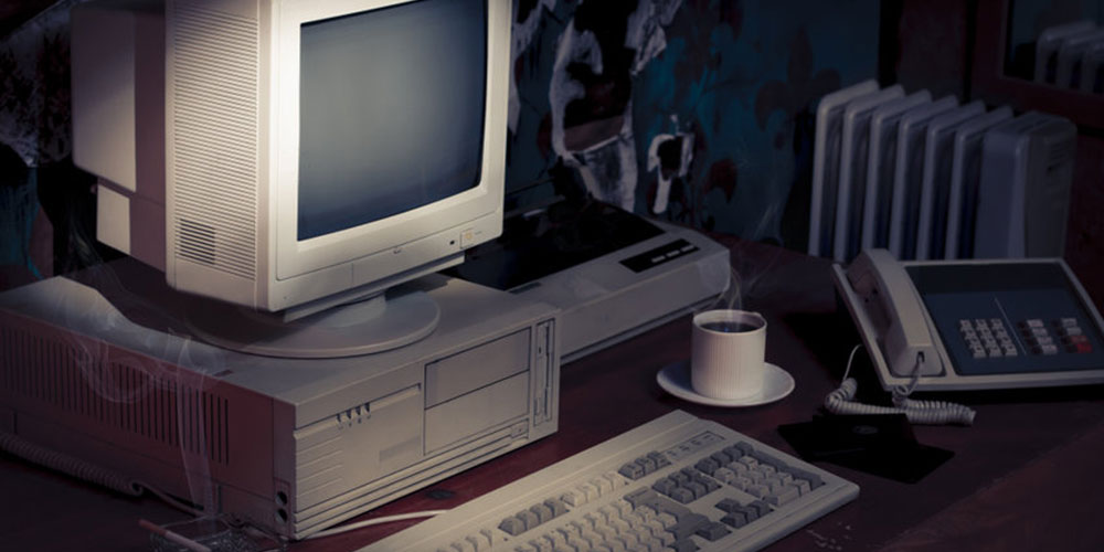 Introverted entrepreneur's old Pc computer on desk 