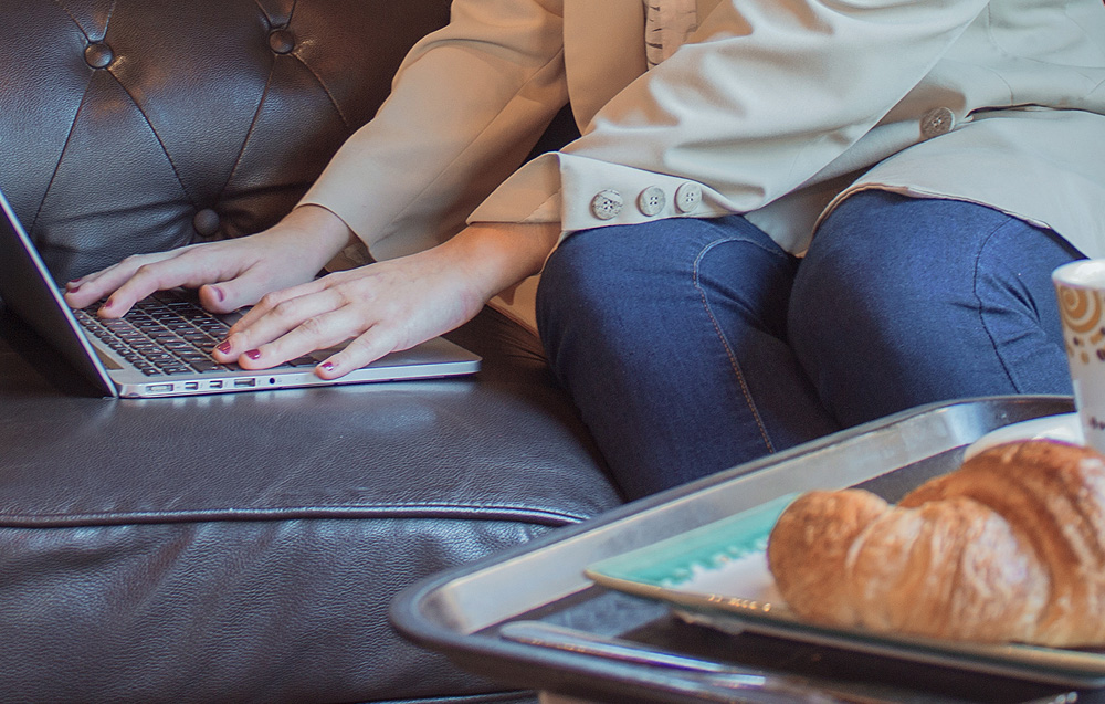 Woman with a chronic illness working from her home couch